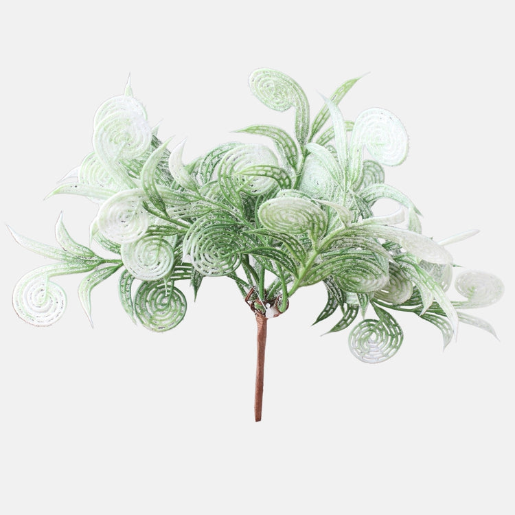 Lumen peittämä oksa, jonka huipussa glitteriä pakkasvihreä - Tekokukat.fi